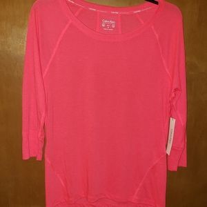 A 3/4 sleeve active wear shirt